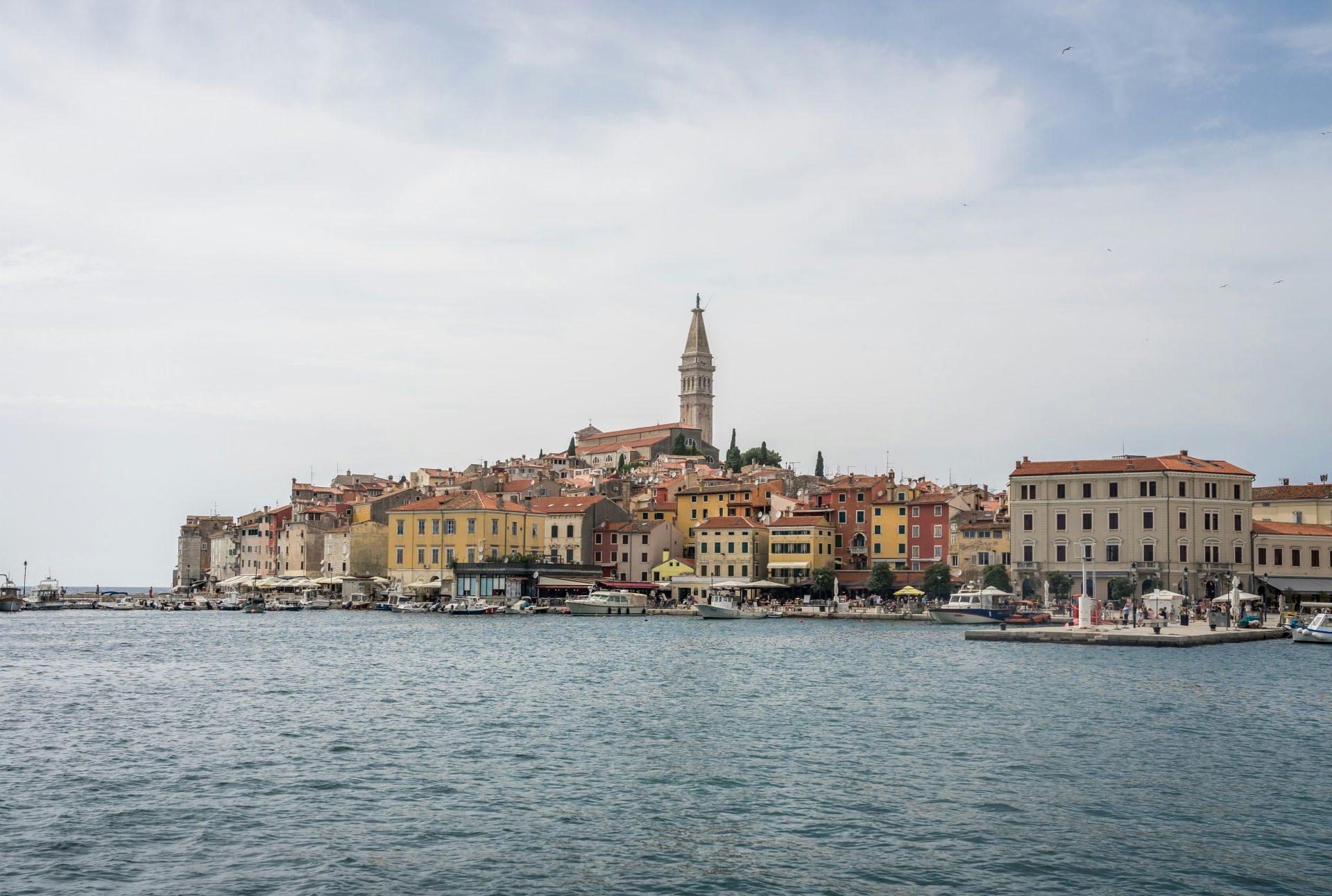 a large body of water with a city in the background